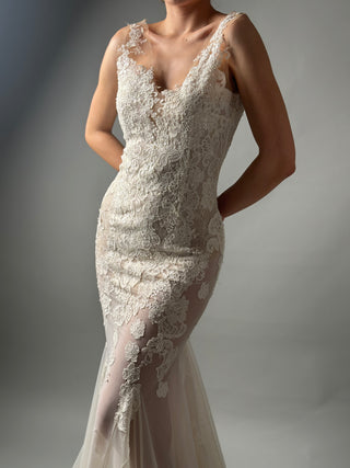 Elegant mermaid floral lace wedding dress with deep V neckline and open back, perfect for modern brides.